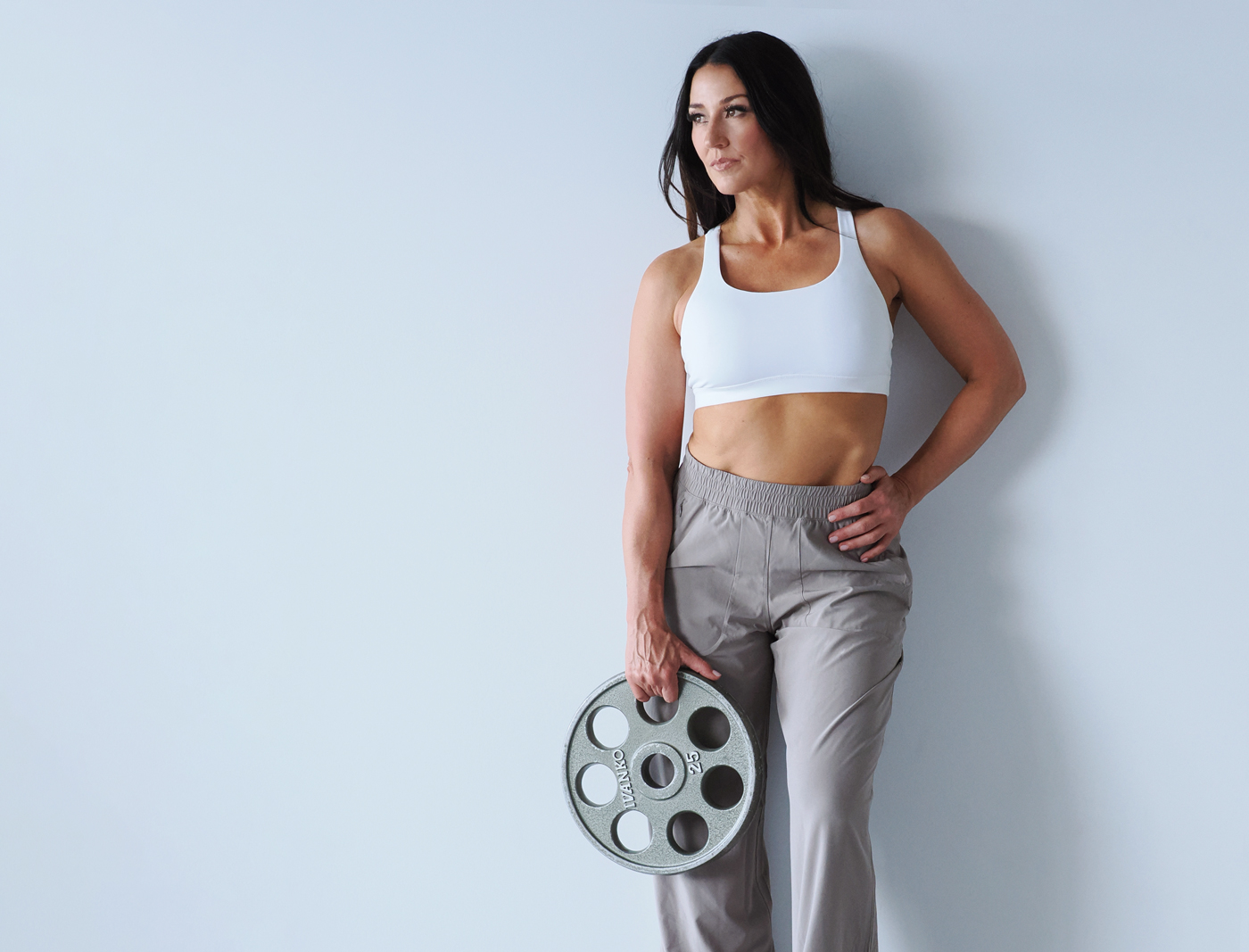 Deirdre Slattery wearing a grey pair of pants and white crop top. This trainer knows that the "thin is in" mentality won't last long.